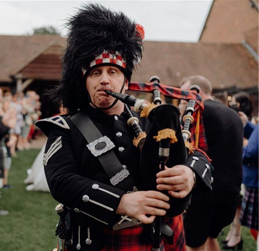 James Robertson Reid playing bagpipes